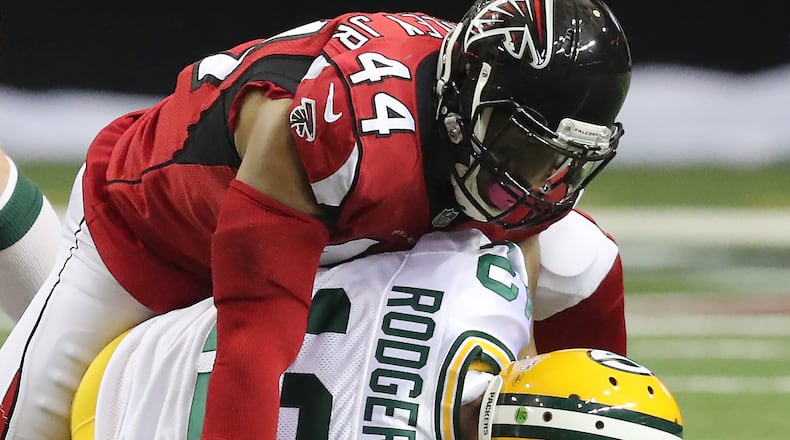 Falcons linebackerVic Beasley Jr. sacks Packers quarterback Aaron Rodgers during the second quarter on Sunday, Oct. 30, 2016, in Atlanta. (Curtis Compton/ccompton@ajc.com)