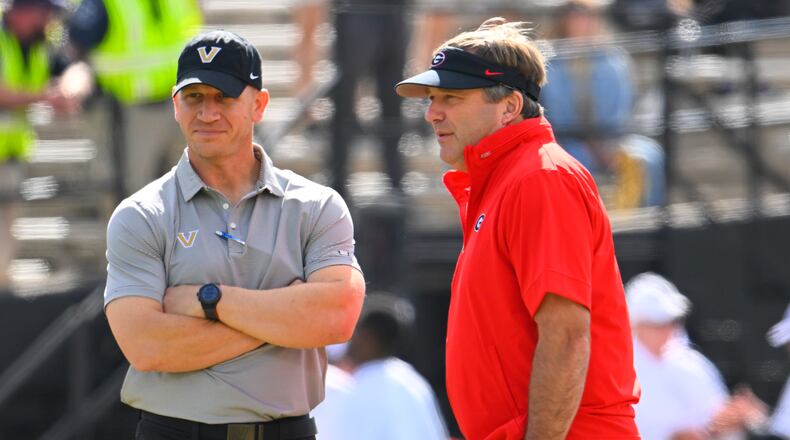 Vanderbilt head coach Clark Lea (left) and Georgia head coach Kirby Smart speak before their game on Saturday, Oct. 14, 2023, in Nashville, Tenn. Vanderbilt does not have the same opportunity that Georgia does this weekend. (John Amis for the AJC 2023)