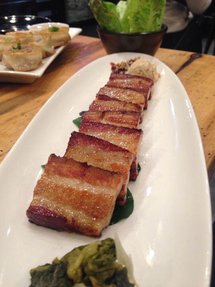 Bossam, tiled of pork belly to wrap in lettuce leaves with sauce