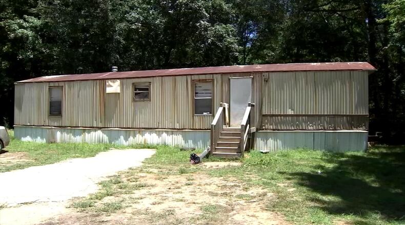 A Gainesville man is dead after someone shot him in the head outside this Gainesville home about 2 a.m. Monday, officials said. (Credit: Channel 2 Action News)