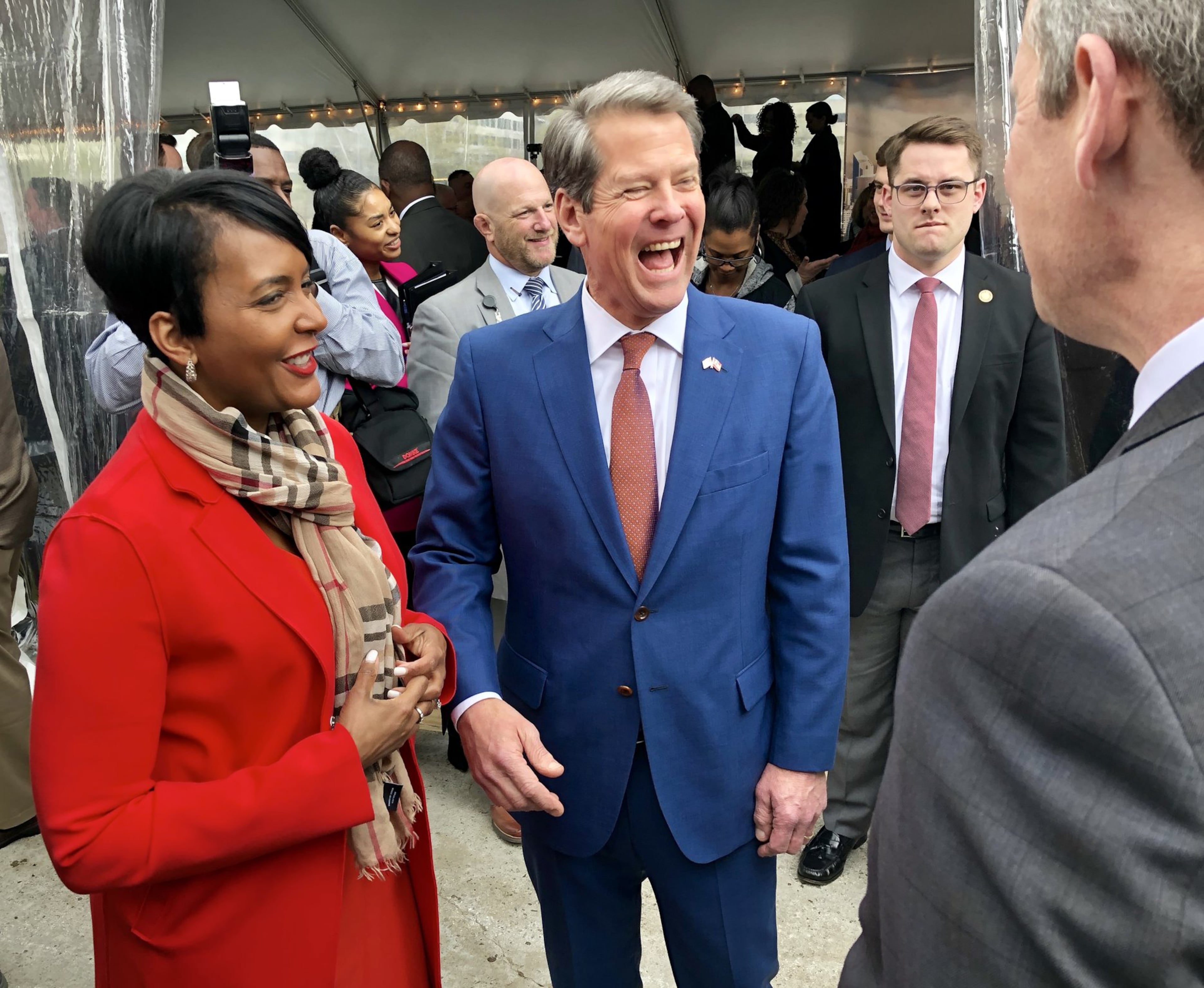 Atlanta Mayor Keisha Lance Bottoms (left) and Georgia Gov. Brian Kemp laugh with Norfolk Southern Chairman and CEO Jim Squires before a 2019 groundbreaking ceremony for the railroad giant’s new Midtown Atlanta headquarters. (J. Scott Trubey/AJC 2019)