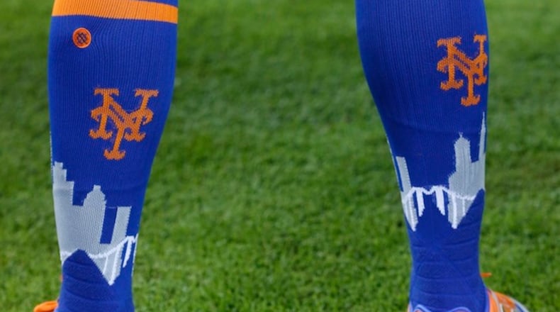 New York Mets center fielder Juan Lagares' socks are shown before the start of a baseball game against the Miami Marlins, Saturday, April 15, 2017, in Miami. (AP Photo/Wilfredo Lee)