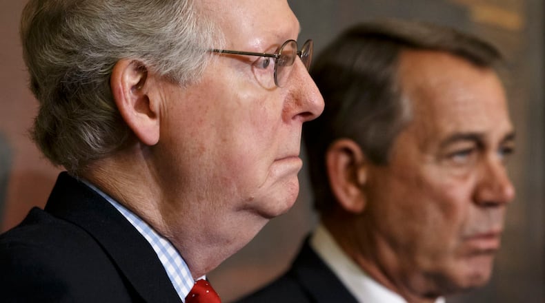 Senate Majority Leader Mitch McConnell, R-Ky., left, and Speaker of the House John Boehner, R-Ohio, stand together at a ceremony before the signing of the bill authorizing expansion of the Keystone XL pipeline, at the Capitol in Washington, Friday, Feb. 13, 2015. Though both houses of Congress are now controlled by Republicans, Boehner and McConnell are at a standstill over provisions attached to a Homeland Security spending bill aimed at blocking President Barack Obama's executive actions on immigration. (AP Photo/J. Scott Applewhite)