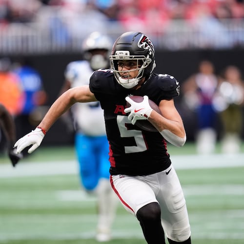 Atlanta Falcons wide receiver Drake London (5) carries against the Carolina Panthers in the first half of an NFL football game, Sunday, Nov. 16, 2025, in Atlanta. (AP Photo/Mike Stewart)
