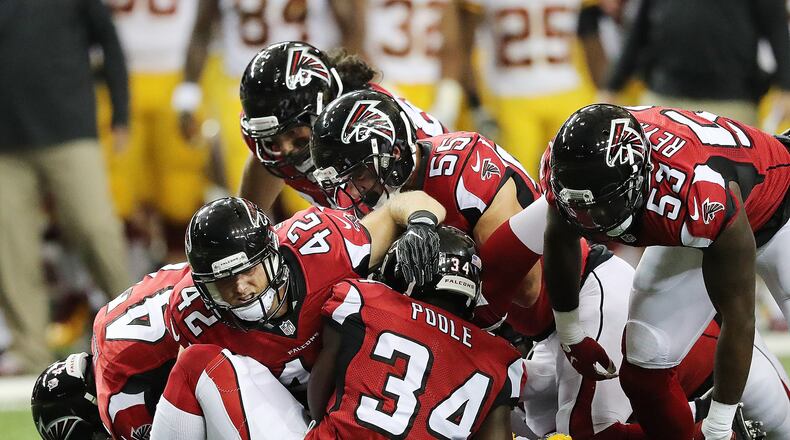 081116 ATLANTA: Falcons defenders swarm Redskins safety Will Blackmon on a punt during the first quarter in an NFL preseason football game on Thursday, August 11, 2016, in Atlanta. Curtis Compton /ccompton@ajc.com