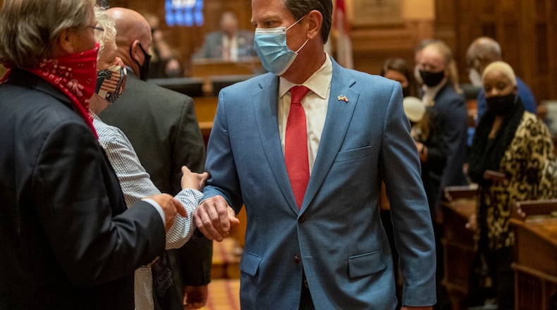 06/26/2020 - Atlanta, Georgia - Gov. Brian Kemp is greeted as he visits the House Chambers on Sine Die, day 40, of the legislative session in Atlanta, Friday, June 26, 2020. (ALYSSA POINTER / ALYSSA.POINTER@AJC.COM)