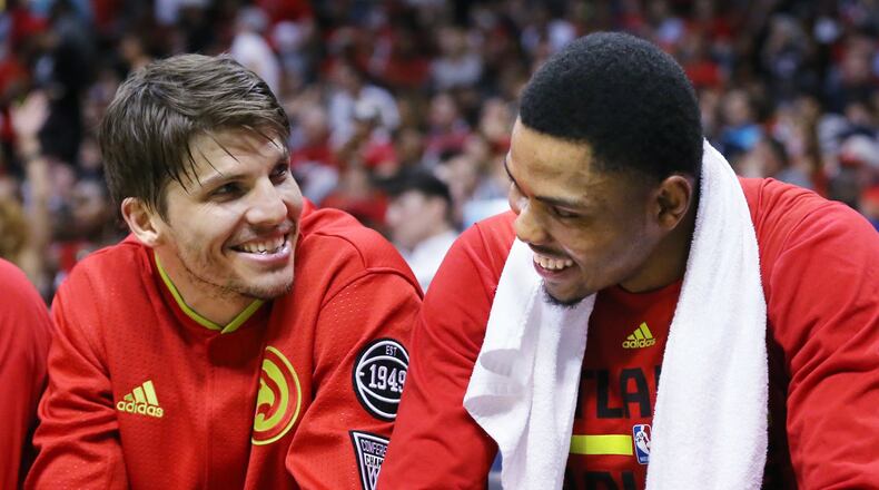With the game well in hand Hawks Kyle Korver and Kent Bazemore share a laugh on the bench in the final minutes of a victory over the Celtics in Game 5 of an NBA basketball first-round playoff series at Philips Arena on Tuesday, April 26, 2016, in Atlanta. Curtis Compton / ccompton@ajc.com