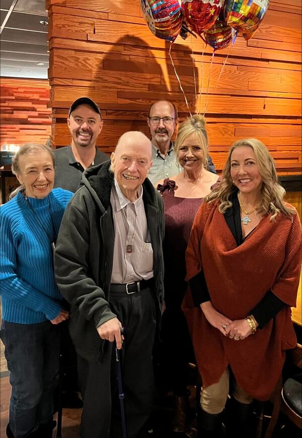 John Moore (front center) at his 80th birthday party at Ansley Golf Club in 2022 with his wife, Nancy (front left), and stepkids (from left) Drew Crissman, David Crissman, Jennifer Head and Laura Fowler. (Courtesy photo)
