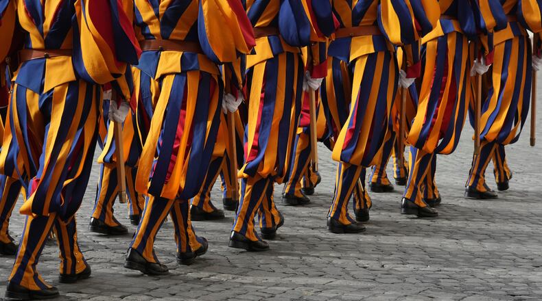 FILE - Swiss Guards march in the St. Damasus Courtyard at the Vatican on Oct. 23, 2025. (AP Photo/Andrew Medichini, File)