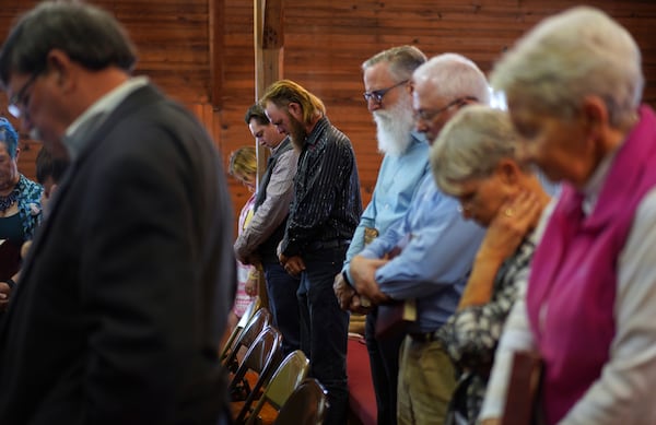 Sacred Harp singers pray at the end of a session at Holly Springs Primitive Baptist Church in Bremen, Ga., on Sunday, March 23, 2025. (AP Photo/Jessie Wardarski)