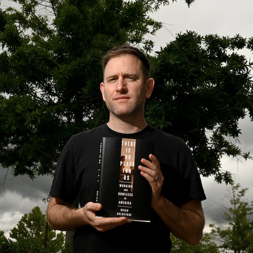 Author Brian Goldstone poses with his Pulitzer Prize-winning nonfiction book “There Is No Place For Us” in Avondale Estates. The Pulitzer website hails it as "a feat of reportage, analysis and storytelling focusing on the issues that have created a national crisis of family homelessness among the so-called working poor." (Hyosub Shin/AJC)