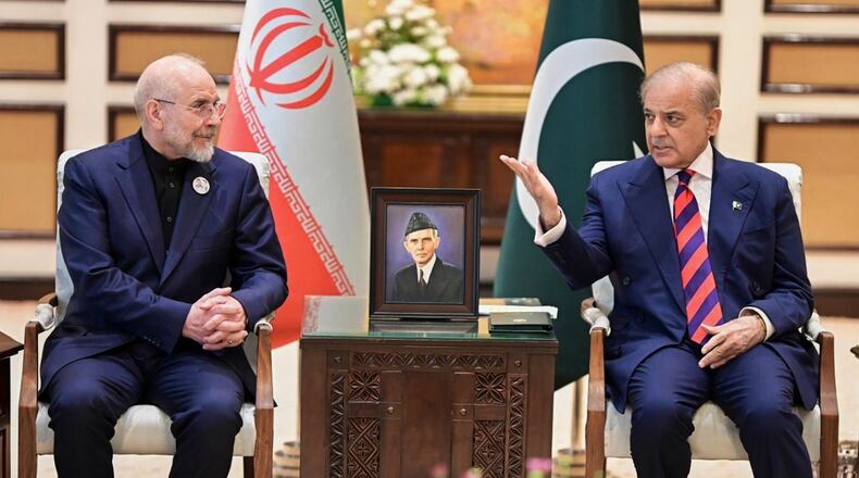 In this photo released by the Pakistan Prime Minister Office, Iran's Parliament Speaker Mohammad Bagher Ghalibaf, left, meets with hand with Pakistani Prime Minister Shehbaz Sharif, in Islamabad, Pakistan, Saturday, April 11, 2026 (Pakistan Prime Minister Office via AP)