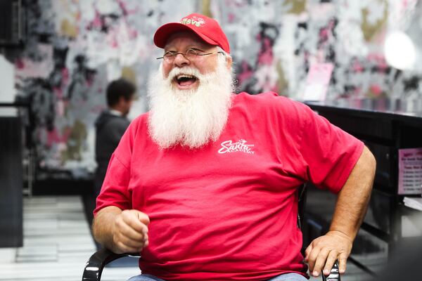 Cesar Janeira credits Rick Rosenthal, the beloved Atlanta Santa who founded the Northern Lights Santa Academy in 2016, with discovering him. (Abbey Cutrer/AJC)