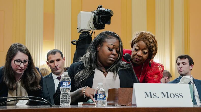 FILE — An emotional Wandrea Moss is comforted by her mother Ruby Freeman, both former election workers in Georgia, during testimony to the House select committee investigating the Jan. 6. attack on the U.S. Capitol, in Washington, June 21, 2022. Prosecutors in the criminal investigation into election interference in Georgia are seeking testimony from three people who took part in the pressure campaign against Ruby Freeman after the 2020 election. (Shuran Huang/The New York Times)