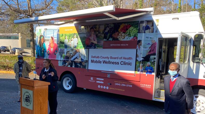 DeKalb County district health director Dr. Sandra Ford (center) speaks during a Dec. 22 press conference announcing the purchase of mobile medical units to help during the pandemic and beyond. She was joined by DeKalb CEO Michael Thurmond (left) and DeKalb Commissioner Larry Johnson (right).