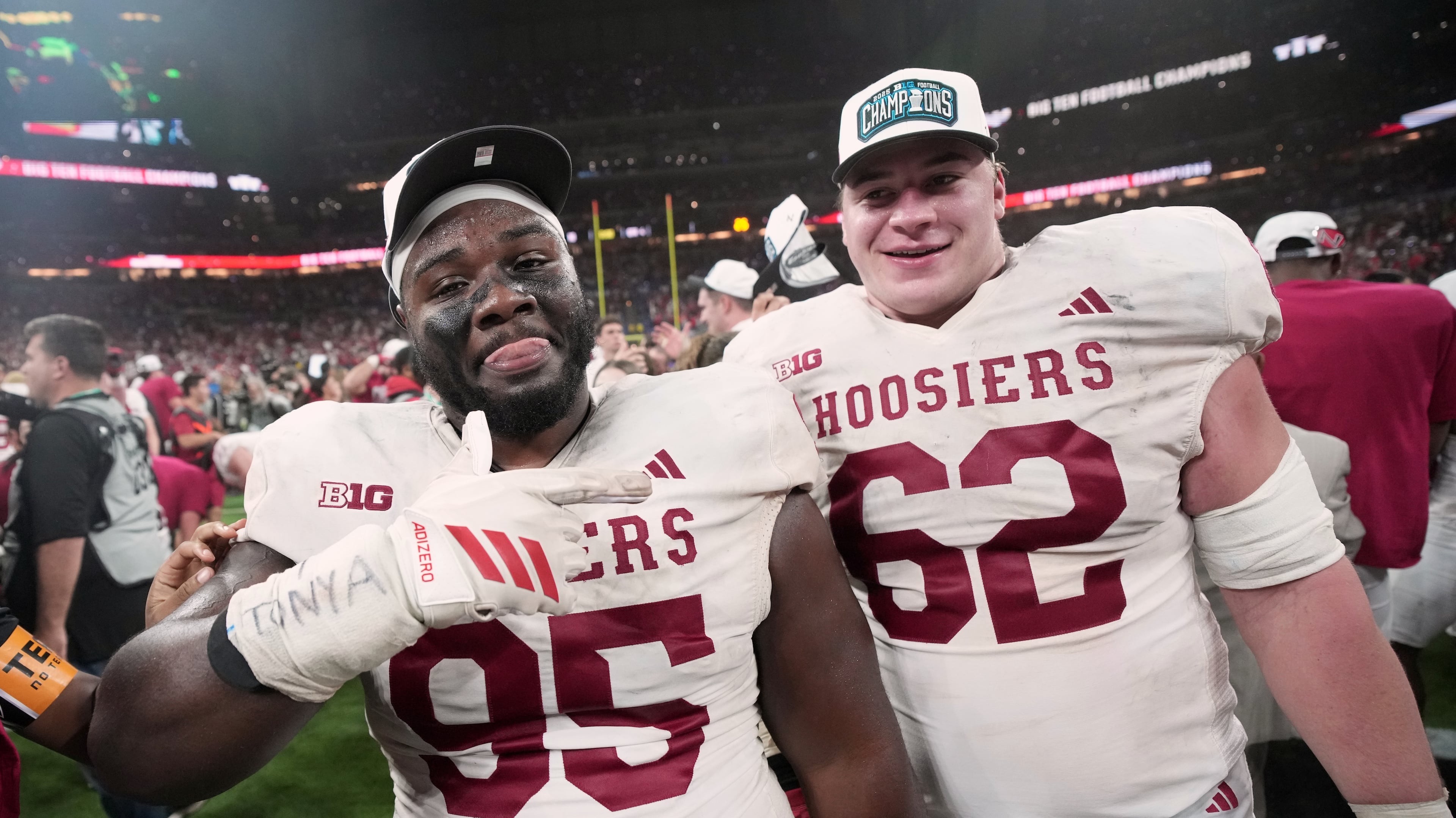 Indiana's Tyrique Tucker and Drew Evans celebrate after the Big Ten championship NCAA college football game against Ohio State in Indianapolis, Saturday, Dec. 6, 2025. (AP Photo/AJ Mast)