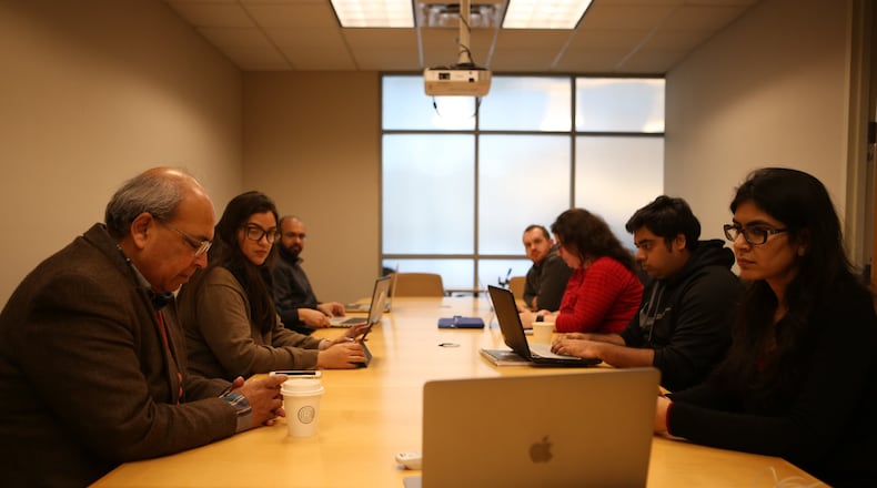 Teaching assistants, part of a group studying the effectiveness of a basic artificial intelligence teaching assistant, participate in a roundtable discussion of the project at Georgia Tech. (HENRY TAYLOR / HENRY.TAYLOR@AJC.COM)