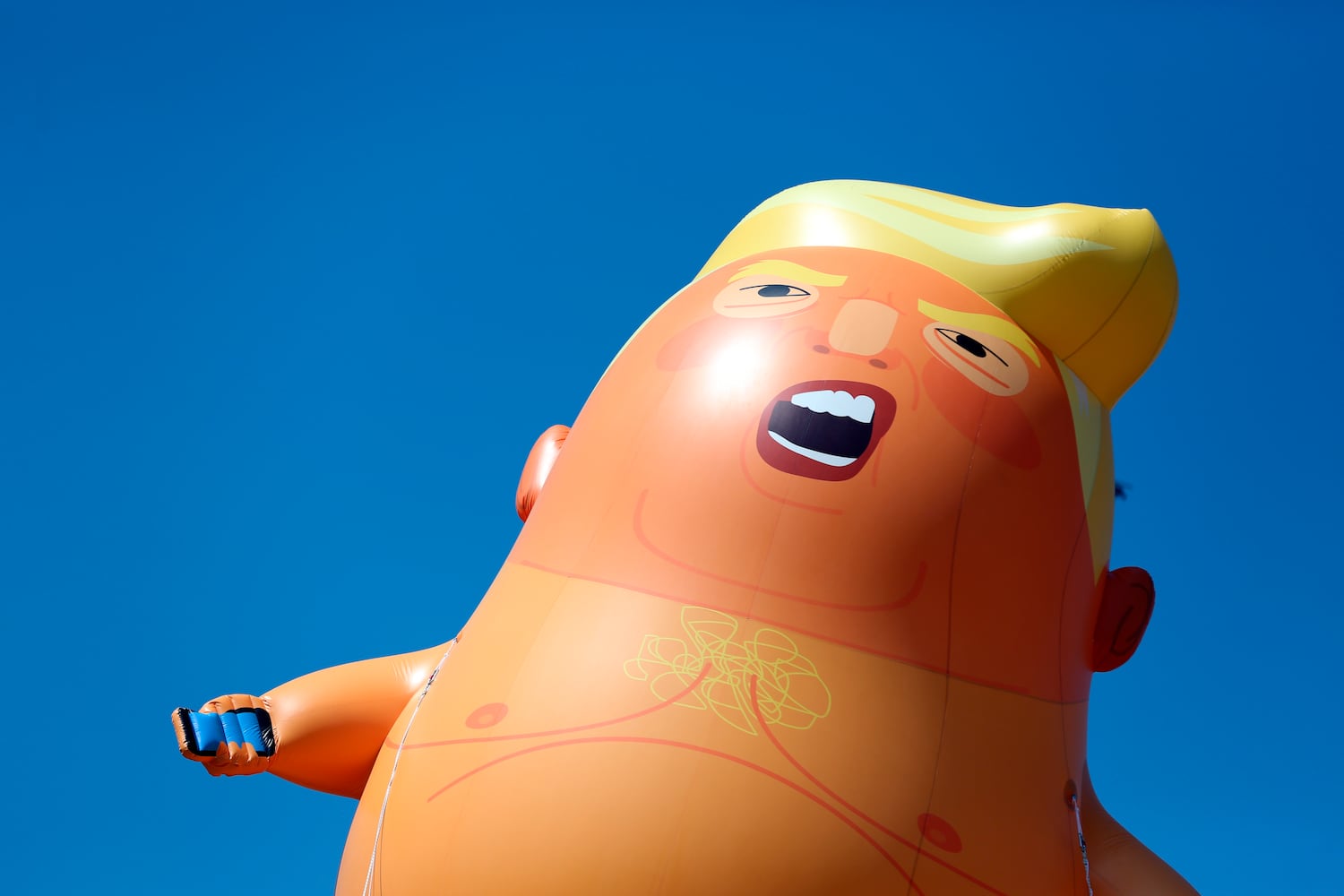 Photos: Baby Trump balloon flies over London protests