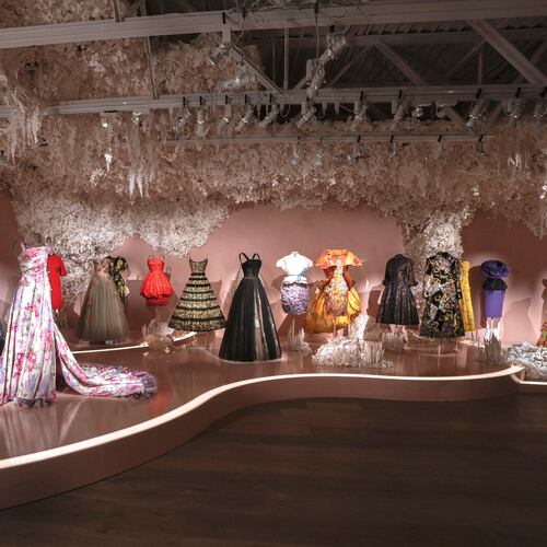 A selection of Dior dresses with floral themes is featured in the exhibition "Dior: Crafting Fashion." (Courtesy of SCAD FASH Museum of Fashion + Film)