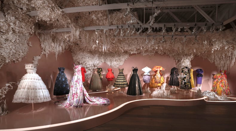A selection of Dior dresses with floral themes is featured in the exhibition "Dior: Crafting Fashion." (Courtesy of SCAD FASH Museum of Fashion + Film)