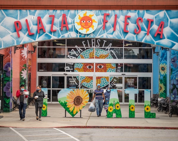 Shoppers exit Plaza Fiesta in this AJC file photo. (Alyssa Pointer / Alyssa.Pointer@ajc.com)