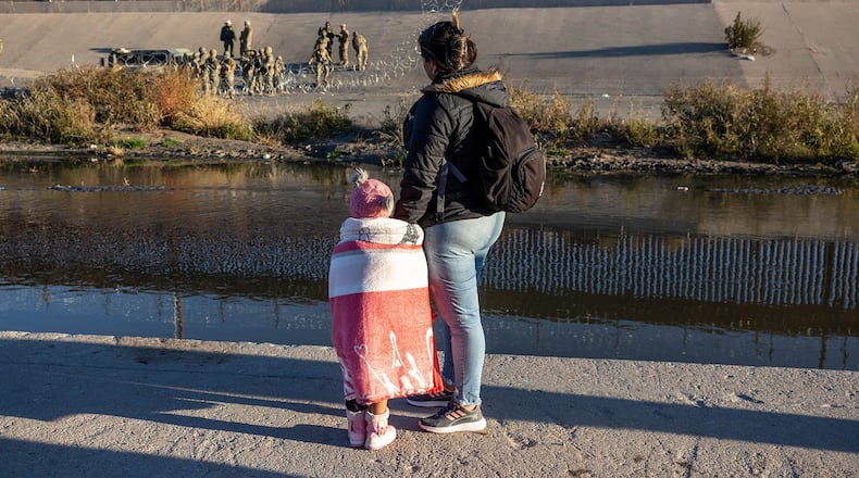 Texas National Guard troops stop migrants from entering a popular crossing area along the bank of the Rio Grande in El Paso, Texas, in 2022. (JOHN MOORE/GETTY IMAGES)