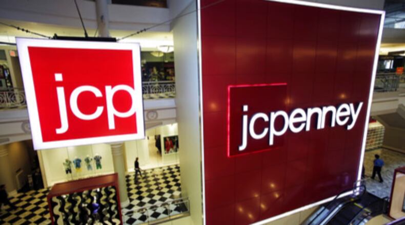 FILE - In this April 9, 2013, file photo, signage at a J.C. Penney store is displayed in New York. J.C. Penney is listing the 138 locations it will shutter in the coming months as the retailer seeks to cut costs and improve its profitability. J.C. Penney Co. is hurting as more people shop online instead of heading to the mall. The closures are part of the company's previously announced plans to focus on its best-performing stores. (AP Photo/Mark Lennihan, File)