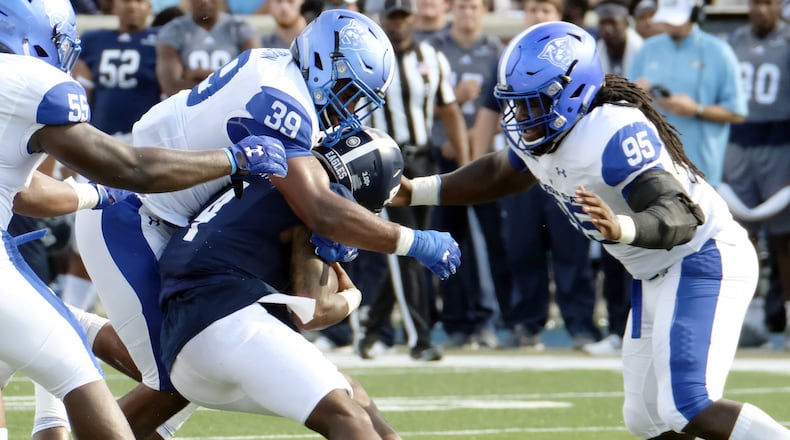 STATESBORO, GA - NOVEMBER 4: Quarterback Shai Wertz #4 of the Georgia Southern Eagles is sacked by linebcker Chase Middleton #39 of the Georgia State Panthers at Paulson Stadium on November 4, 2017 in Statesboro, Georgia. (Photo by Todd Bennett/Getty Images)