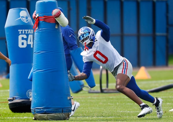 New York Giants linebacker Brian Burns runs a drill during NFL football practice in East Rutherford, N.J., Thursday, June 5, 2025. (AP Photo/Noah K. Murray)