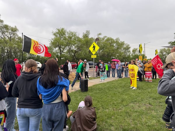Protestors gather outside the South Dakota State Penitentiary on Friday, May 23, 2025 to protest about recent prison deaths. (AP Photo/Sarah Raza)