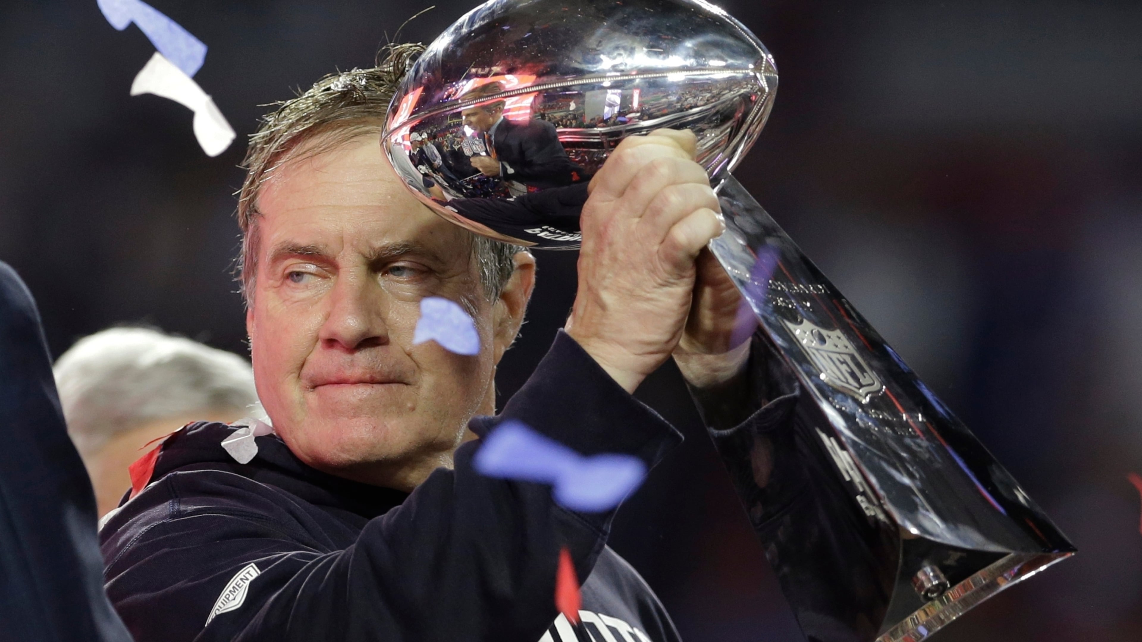 FILE - New England Patriots head coach Bill Belichick holds up the Vince Lombardi Trophy as he celebrates after the Patriots defeated the Seattle Seahawks 28-24 in NFL Super Bowl XLIX football game Sunday, Feb. 1, 2015, in Glendale, Ariz. (AP Photo/Patrick Semansky, File)
