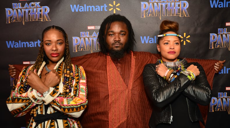 Atlanta moviegoers put pride on display with African influenced outfits at an advance screening hosted by T.I. and Walmart. Image by Aric Thompson.