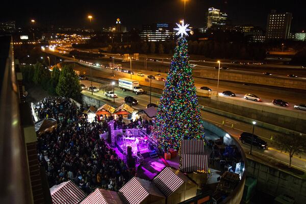 A large Christmas tree lights up during the Light the Station 2018 holiday event Saturday, November 17, 2018, at Atlantic Station in Atlanta. (Photo: STEVE SCHAEFER / SPECIAL TO THE AJC)