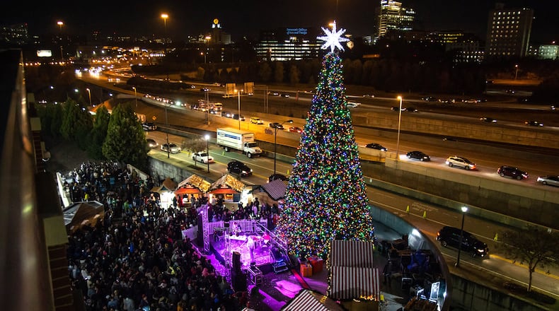 A large Christmas tree lights up during the Light the Station 2018 holiday event Saturday, November 17, 2018, at Atlantic Station in Atlanta. (Photo: STEVE SCHAEFER / SPECIAL TO THE AJC)