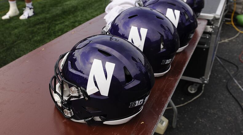FILE - Northwestern football helmets at an NCAA college football against Stanford in Evanston, Ill, Sept. 5, 2015. (AP Photo/Matt Marton, File)