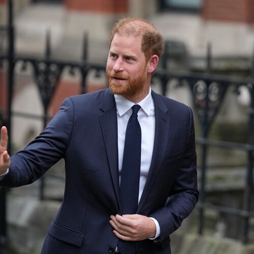 Britain's Prince Harry waves as he arrives at London's High Court to lead a group, including Elton John and Elizabeth Hurley, accusing the Daily Mail's publisher of privacy invasion through unlawful tactics in a trial that is part of a wider phone hacking scandal in London, Monday, Jan. 19, 2026. (AP Photo/Alastair Grant)
