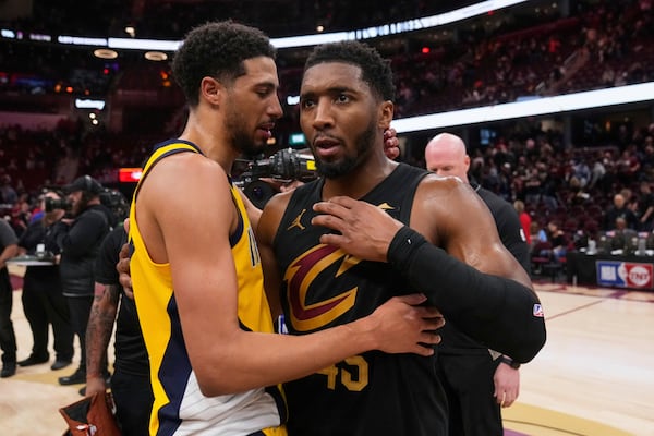 Indiana Pacers guard Tyrese Haliburton, left, and Cleveland Cavaliers guard Donovan Mitchell greet each other after the Pacers defeated the Cleveland Cavaliers 114-105 in Game 5 of an Eastern Conference semifinal NBA basketball playoff Tuesday, May 13, 2025, in Cleveland. (AP Photo/Sue Ogrocki)