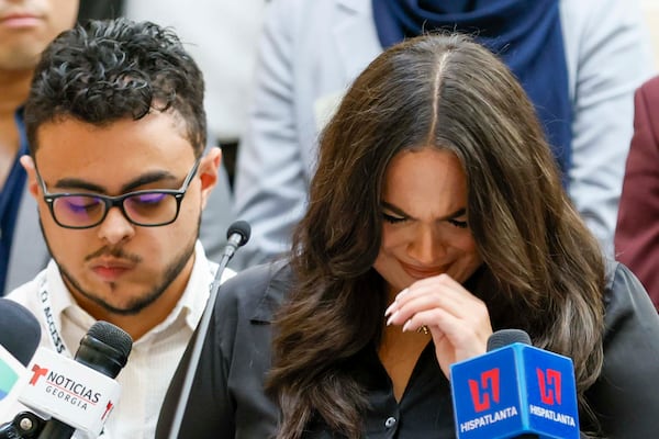 Spanish-language journalist Mario Guevara’s daughter, Katherine Guevara, reacts as she struggles to find words during a press conference at the Georgia State Capitol on Tuesday, July 22, 2023. (Miguel Martinez/AJC)