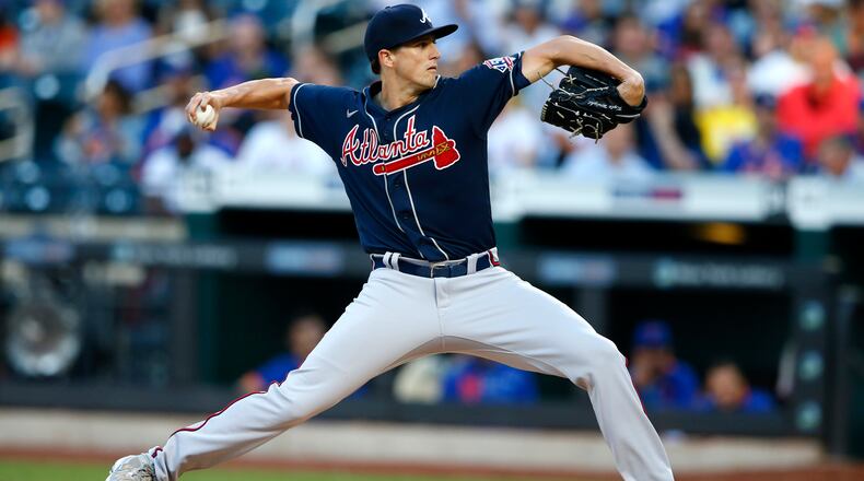Braves starting pitcher Kyle Wright (30) throws against the New York Mets during the first inning of a baseball game Wednesday, June 23, 2021, in New York.