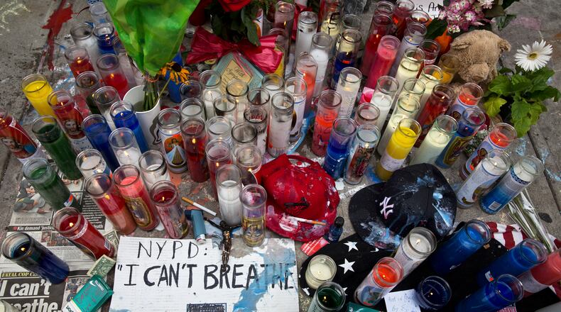FILE — A memorial for Eric Garner, on the spot in Staten Island where he died after a police officer used a chokehold to subdue him, in New York, July 19, 2014. A grand jury has reportedly declined to indict that officer, Daniel Pantaleo, a decision which city officials fear will only fuel protests already underway related to the Michael Brown case in Ferguson, Mo. (Todd Heisler/The New York Times) A memorial where Eric Garner was subdued by police. (New York Times photo/Todd Heisler)