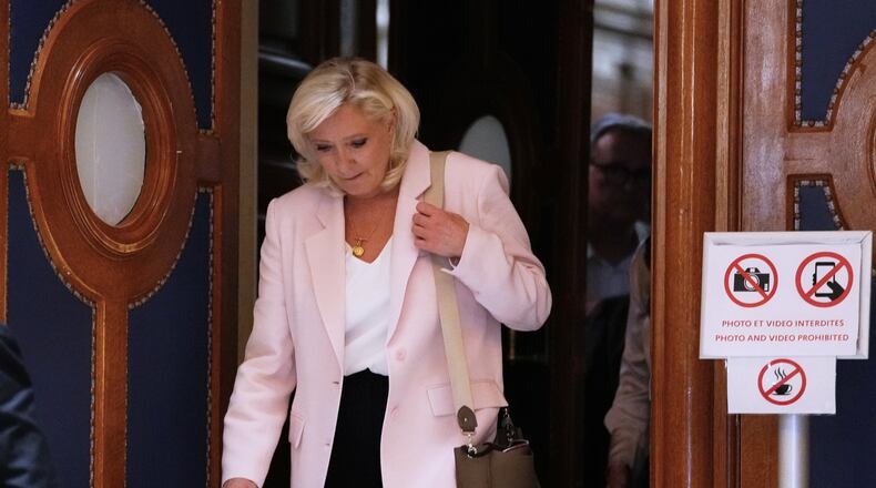 Far-right leader Marine Le Pen leaves the courtroom after the verdict of her appeal trial, in Paris, France, Tuesday, July. 7, 2026. (AP Photo/Aurelien Morissard)
