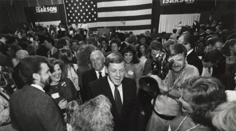 Republican gubernatorial candidate Johnny Isakson works the crowd on the night he won the GOP primary, July 17, 1990, at his party headquarters at the Waverly Hotel. (John Spink / AJC Archive at GSU Library AJCP431-016g)
