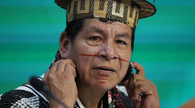 Cline Jorge Chauca Lopez listens during a session on the Indigenous strategy for fires and droughts in the Amazon during the COP30 U.N. Climate Summit, Monday, Nov. 10, 2025, in Belem, Brazil. (AP Photo/Fernando Llano)