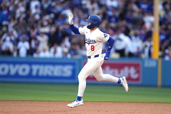 Los Angeles Dodgers' Kiké Hernández gestures as he heads to second after hitting a solo home run during the fourth inning of a baseball game against the Los Angeles Angels, Saturday, May 17, 2025, in Los Angeles. (AP Photo/Mark J. Terrill)