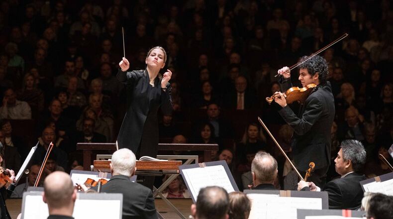 Guest conductor Karina Canellakis leads violinist Itamar Zorman and the ASO in Berg’s violin concerto. PHOTO: Jeff Roffman