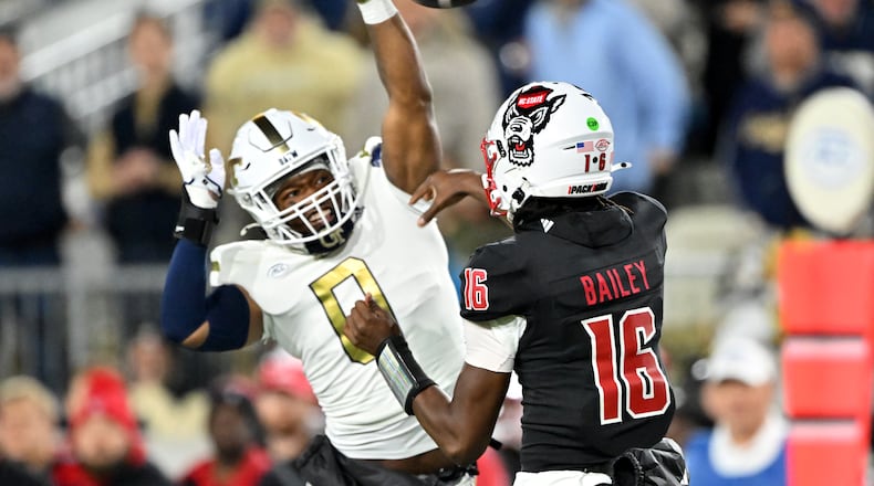 Georgia Tech linebacker Trenilyas Tatum (0) blocks a pass by North Carolina State quarterback CJ Bailey (16) during the first half of an NCAA college football game at Georgia Tech's Bobby Dodd Stadium, Thursday, November 21, 2024, in Atlanta. (Hyosub Shin / AJC)