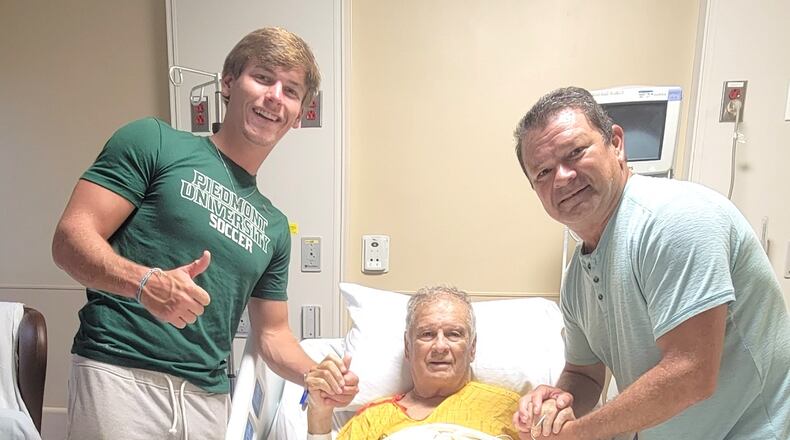 Jason Aussin (left), 20, saved his grandfather's life by administering CPR on a golf course July 24. Courtesy of Kathy Aussin