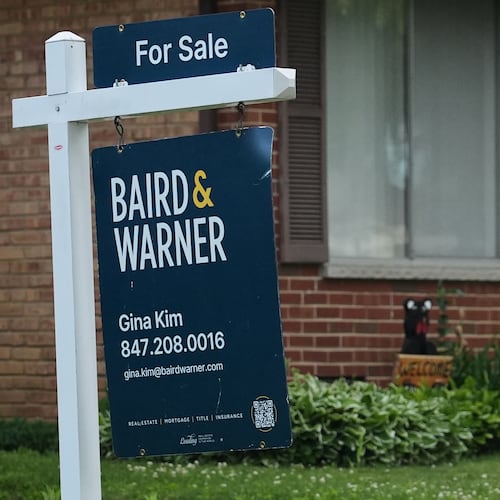 For sale sign is seen outside of a home in Wheeling, Ill., Monday, June 8, 2026. (AP Photo/Nam Y. Huh)