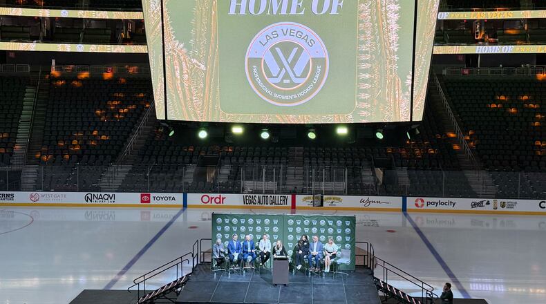 The NHL Network's Jamie Hersch, at podium, and officials announce the PWHL women's hockey expansion team beginning in the 2026-27 season, Wednesday, May 13, 2026 in Las Vegas. Hamilton, Ontario, also was added on Wednesday. (AP Photo/Mark Anderson