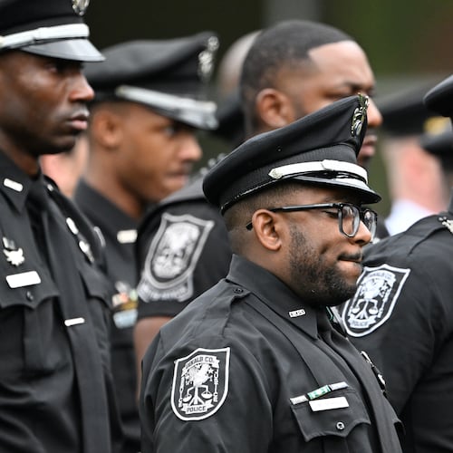 DeKalb County officers attend at a memorial service for officer David Rose, who was killed while responding to the Aug. 8, 2025, shooting at the Centers for Disease Control and Prevention. (Hyosub Shin/AJC 2025)